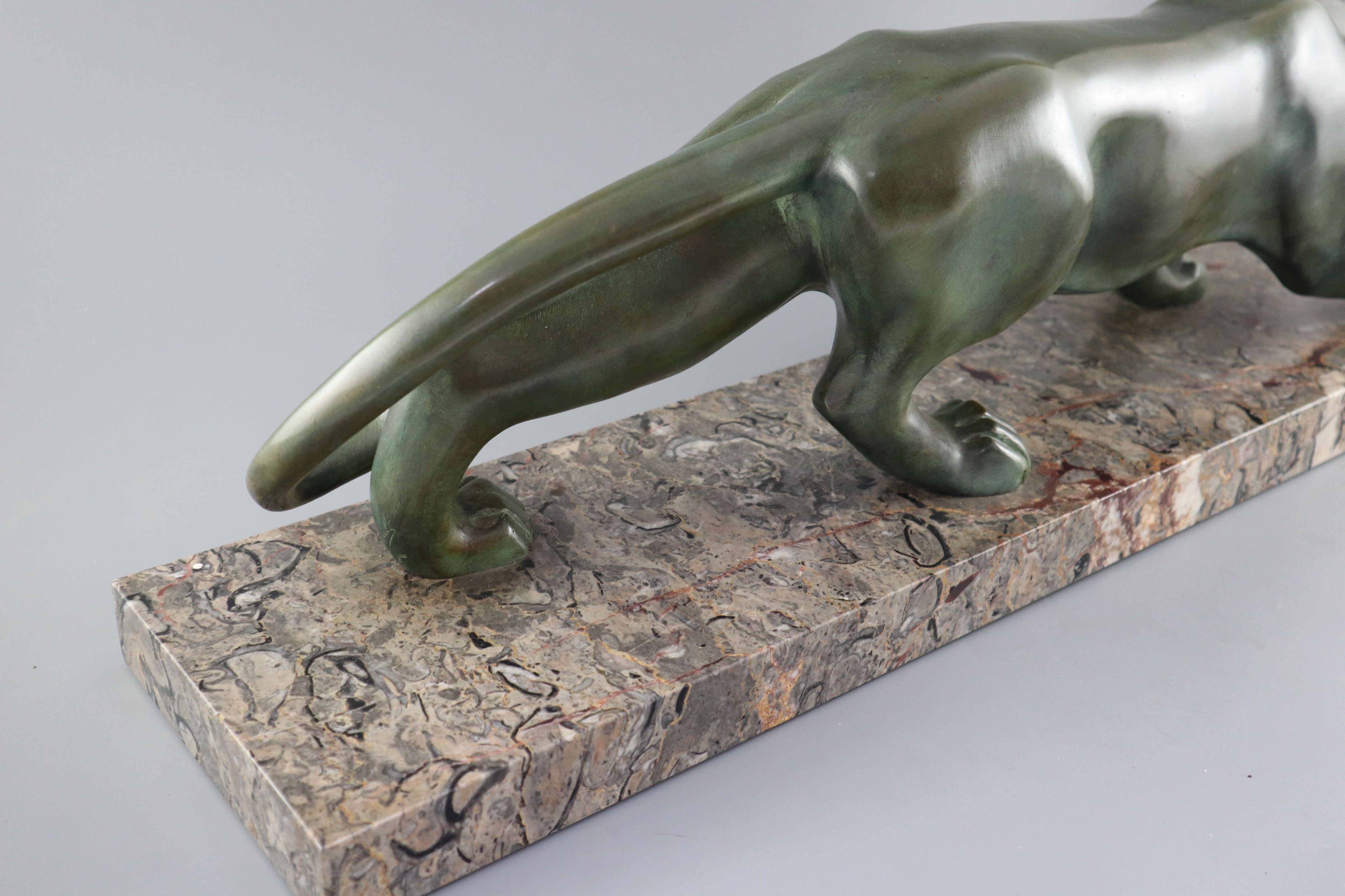 Brault. An Art Deco patinated bronze model of a prowling panther, width 29.5in. height 8.5in.